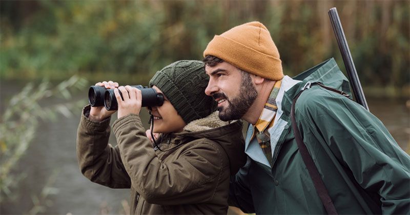 carrying binoculars